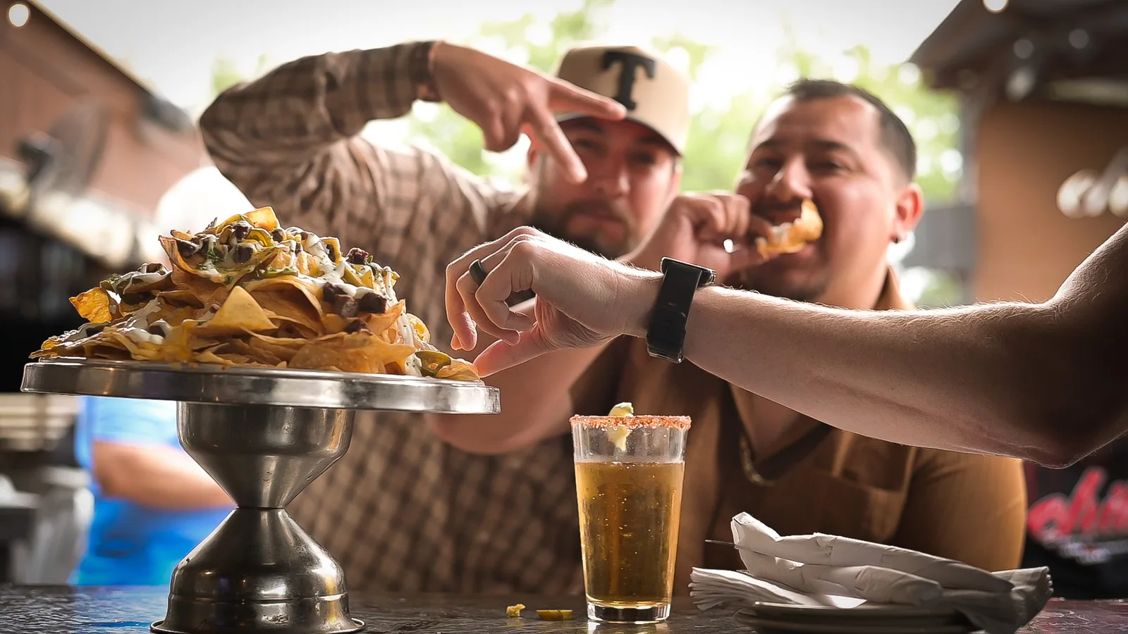 patrons enjoying nachos at Chill Bar & Grill in Lewisville, TX