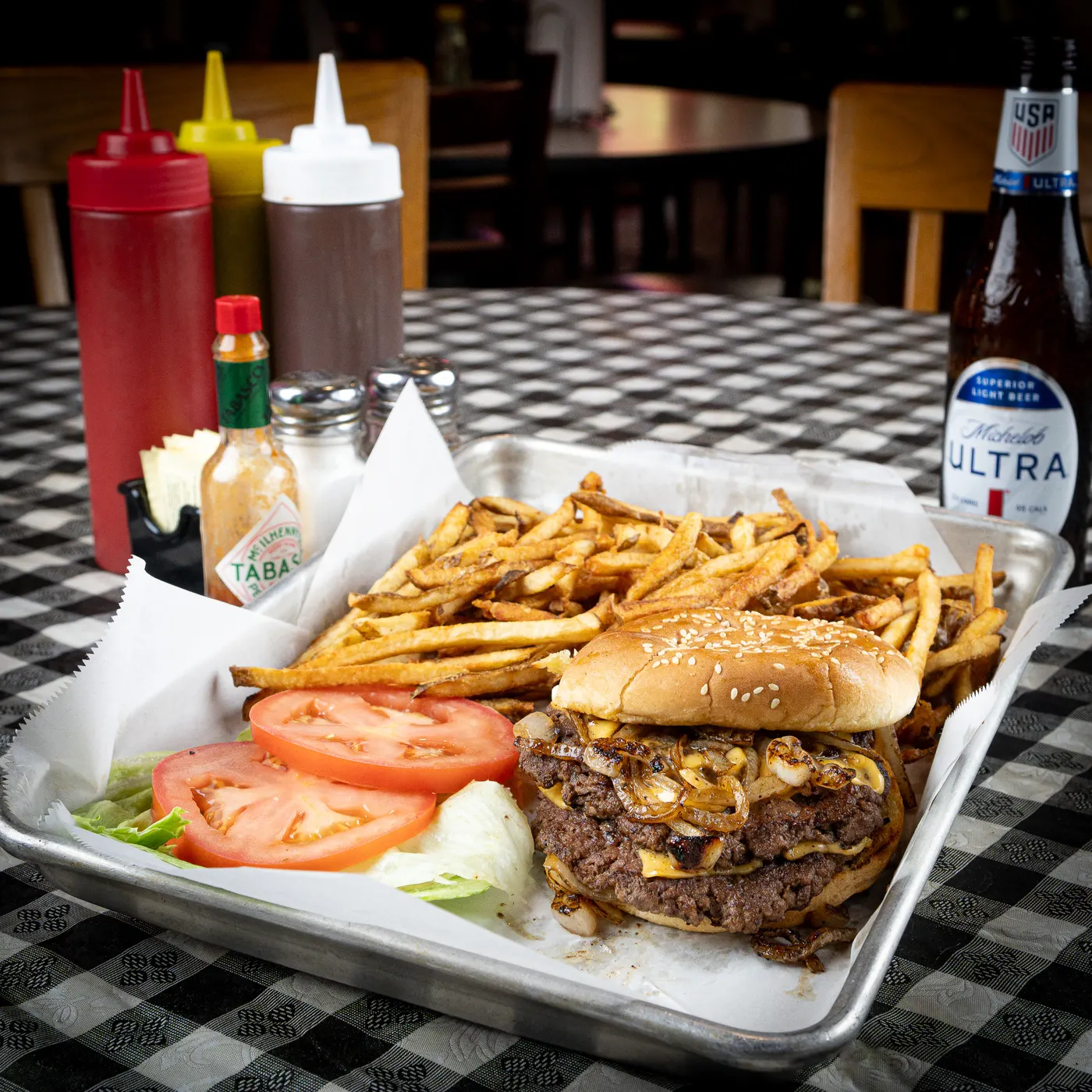 A smash burger with griddled onions and hand-cut fries