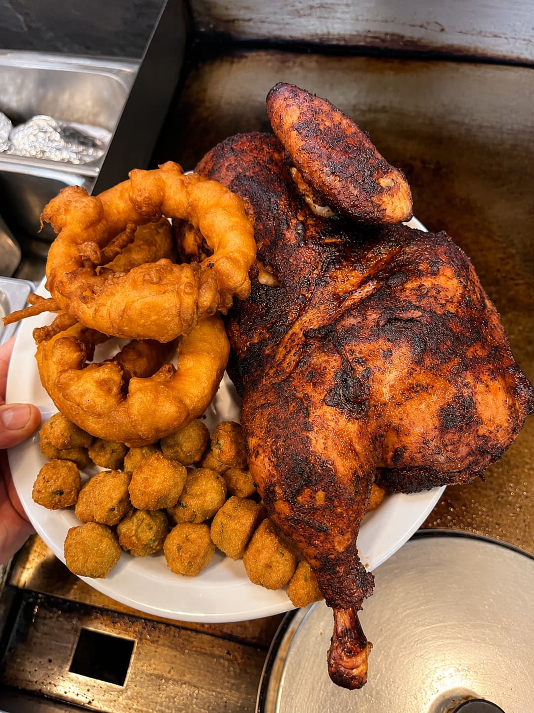 Half smoked chicken with onion rings and fried okra