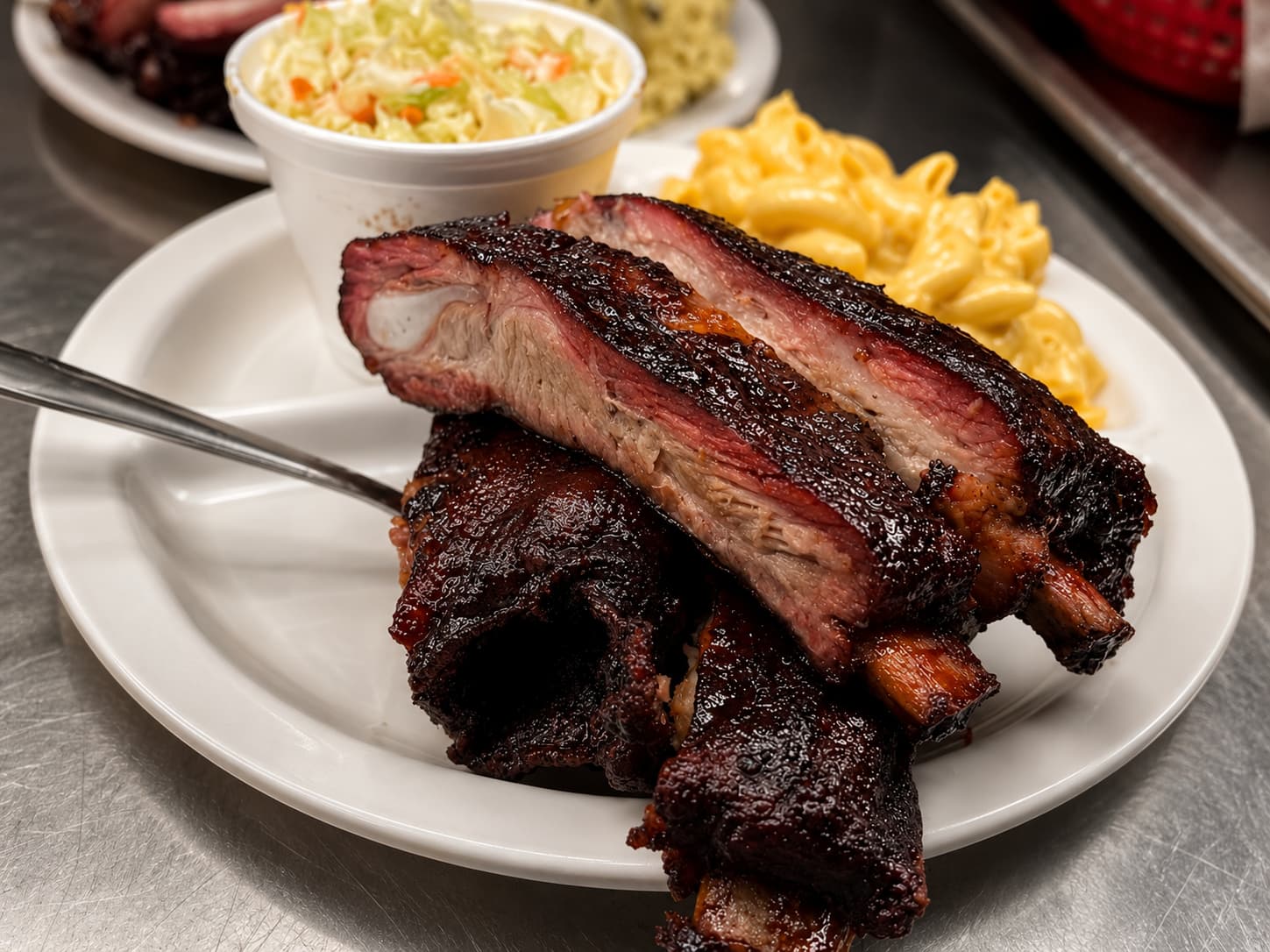Pork ribs plate with mac and cheese and slaw